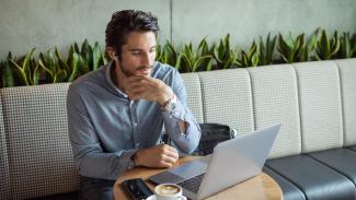 man-at-coffeshop-with-laptop